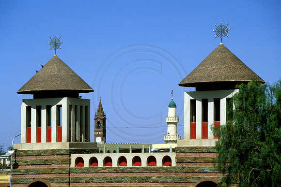 Gateway of Enda Mariam Cathedral showing Grand Mosque minaret and Catholic Cathedral bell tower